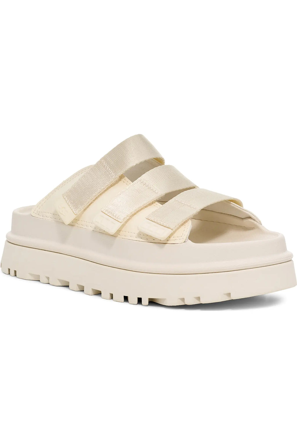 A cream-colored platform slide sandal with wide satin straps and a chunky lug sole, shown from a side profile on a white background.