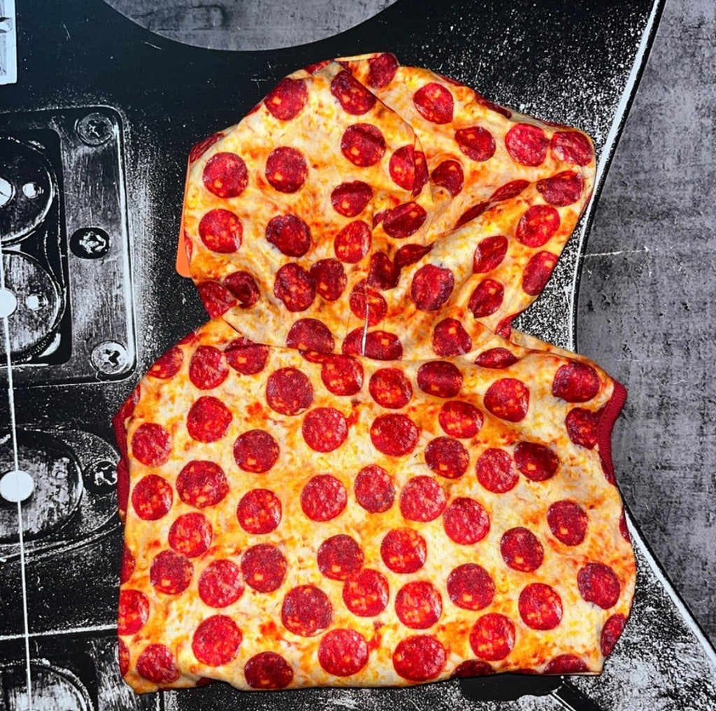 A novelty hooded sweatshirt designed to look like a slice of pepperoni pizza, featuring a printed design of melted cheese, golden crust, and numerous red pepperoni slices, laid flat on a black and gray guitar headstock.