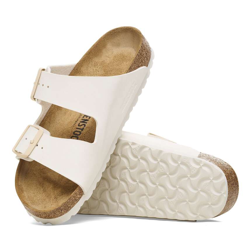 White sandals with cork soles on a white background