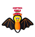 Kong Ballistic dog toy shaped like a bat, featuring black wings with orange stitching, a yellow face, and an orange body, shown with its retail packaging on a white background.