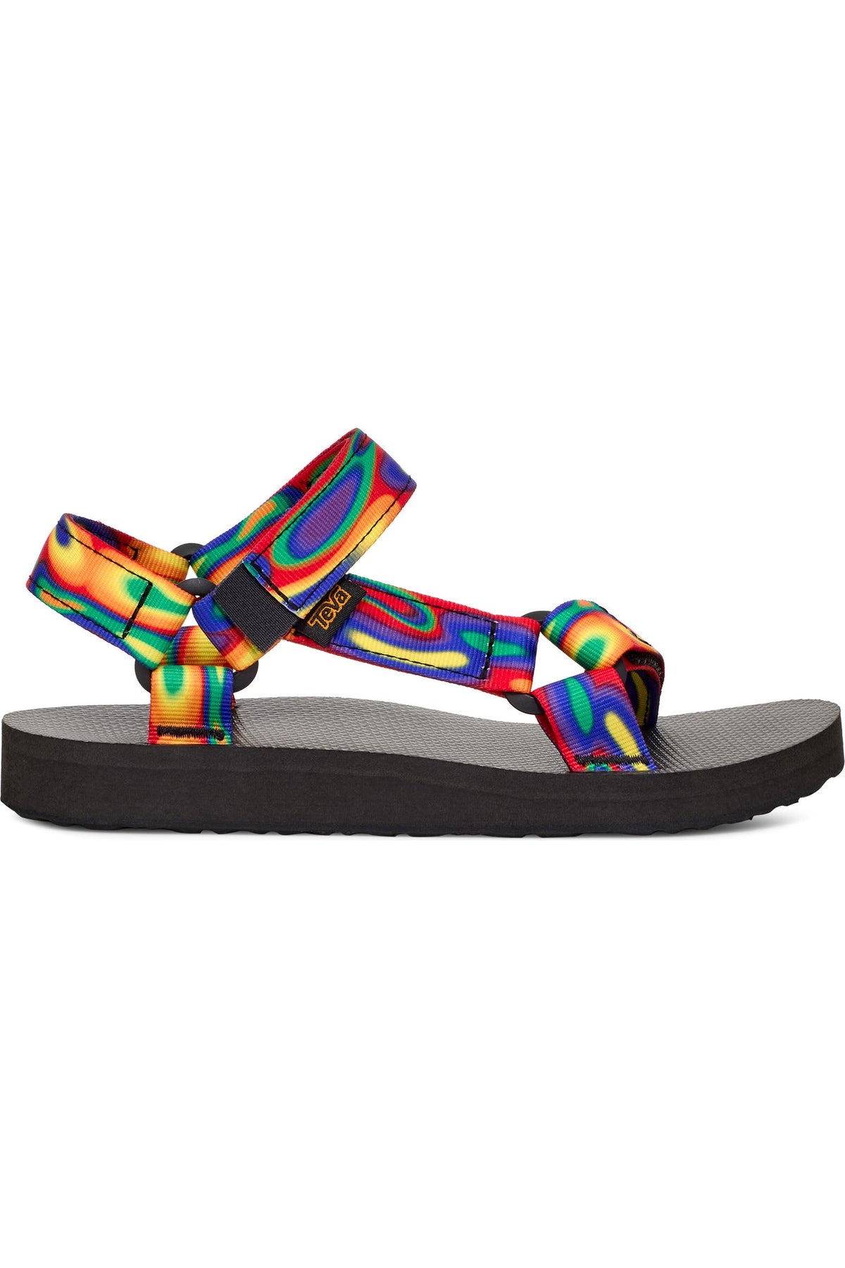 A single Teendrop sandal shown in profile against a plain white background. The sandal features a black sole and footbed, with vibrant, multicolored rainbow-patterned straps.
