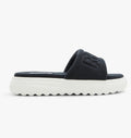 Black slide sandal with brand logo on a white background